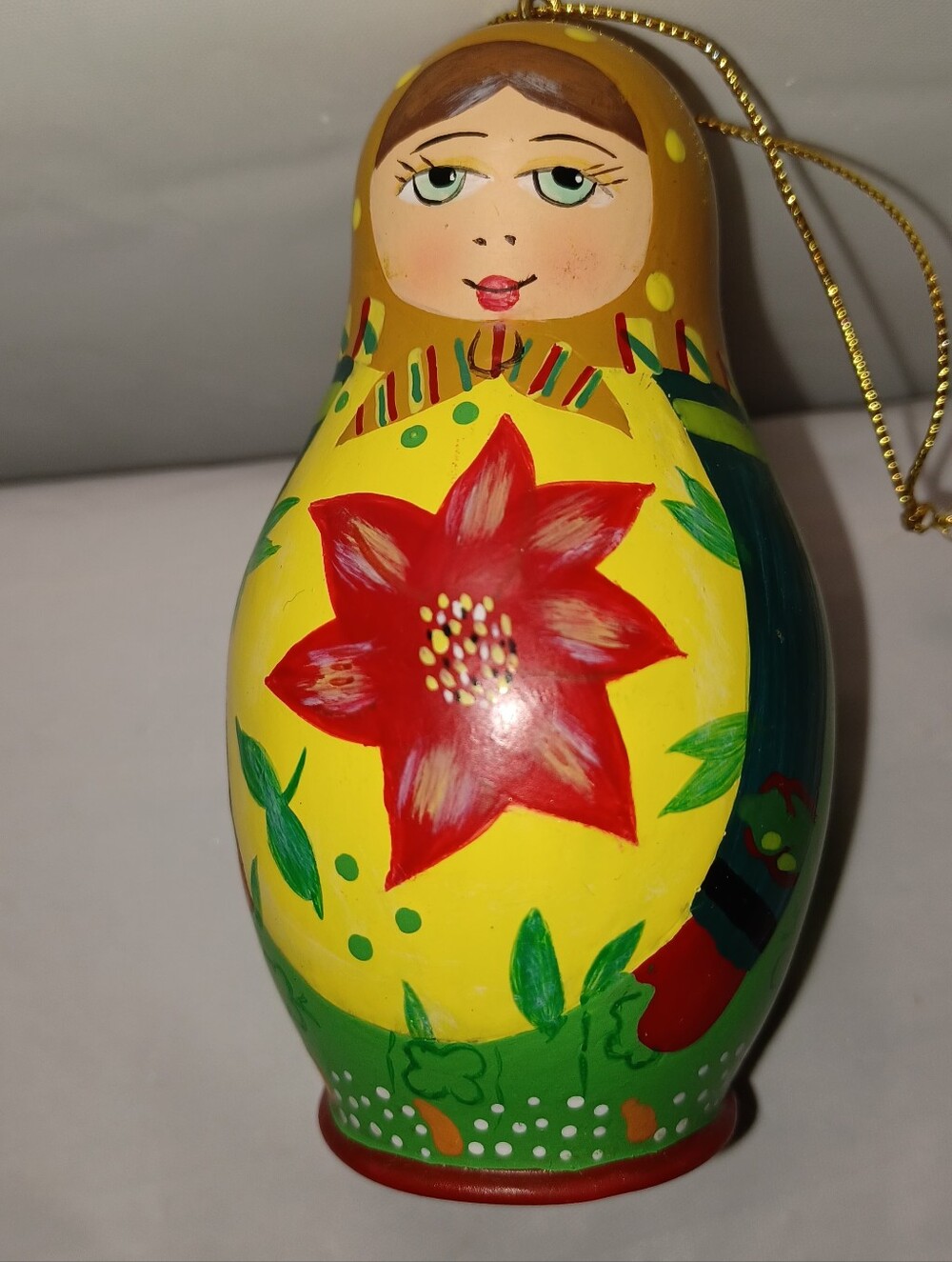 Hand-Painted Yellow Matryoshka Ornament with Red Flower